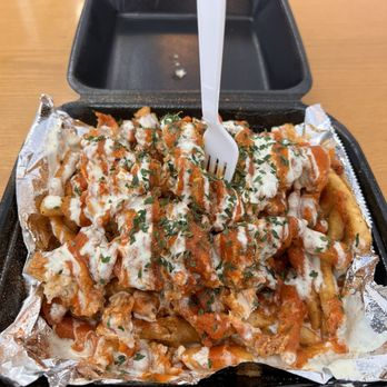 Loaded Fries at Mac Daddy Wingz — tenders, sauce drizzle, and ranch on crispy fries