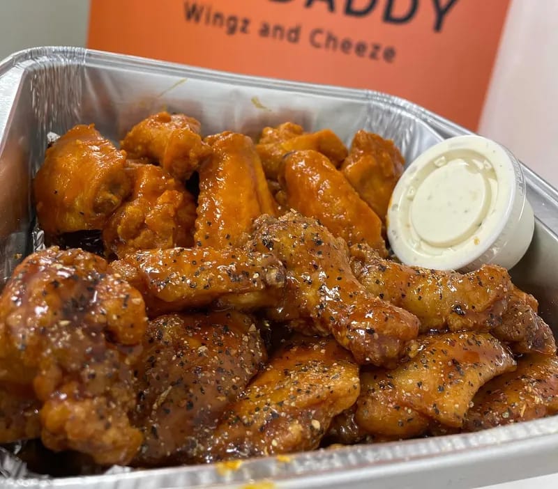 Buffalo-sauced chicken wings with ranch dipping sauce at Mac Daddy Wingz and Cheeze Tempe